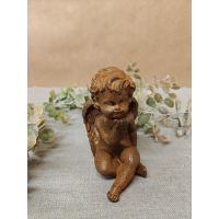 engel zittend van gietijzer