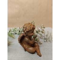 engel zittend van gietijzer