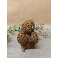 engel zittend van gietijzer